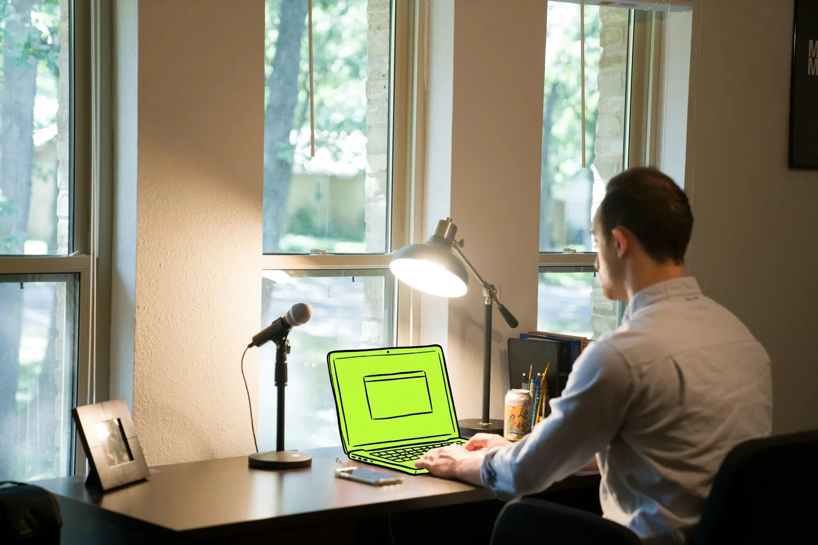 A remote worker at a home office desk by the window, the laptop drawn in lime ink